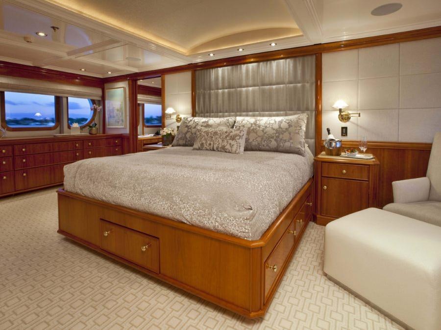 a large bed in a room aboard LEVERAGE Yacht for Charter