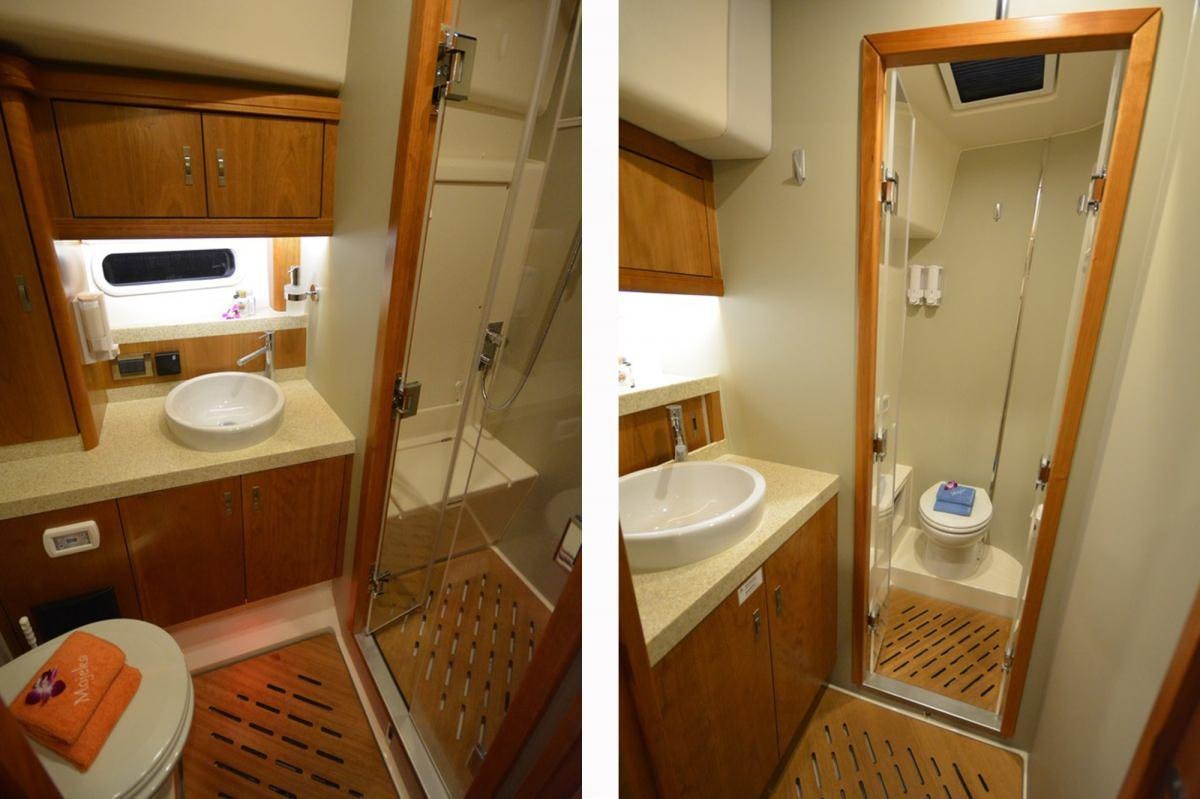 a bathroom with a sink and a shower aboard MOJEKA  Yacht for Charter