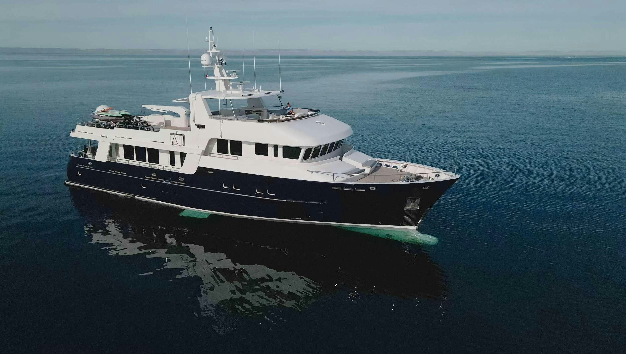 a large white ship in the water aboard SAMSARA Yacht for Charter