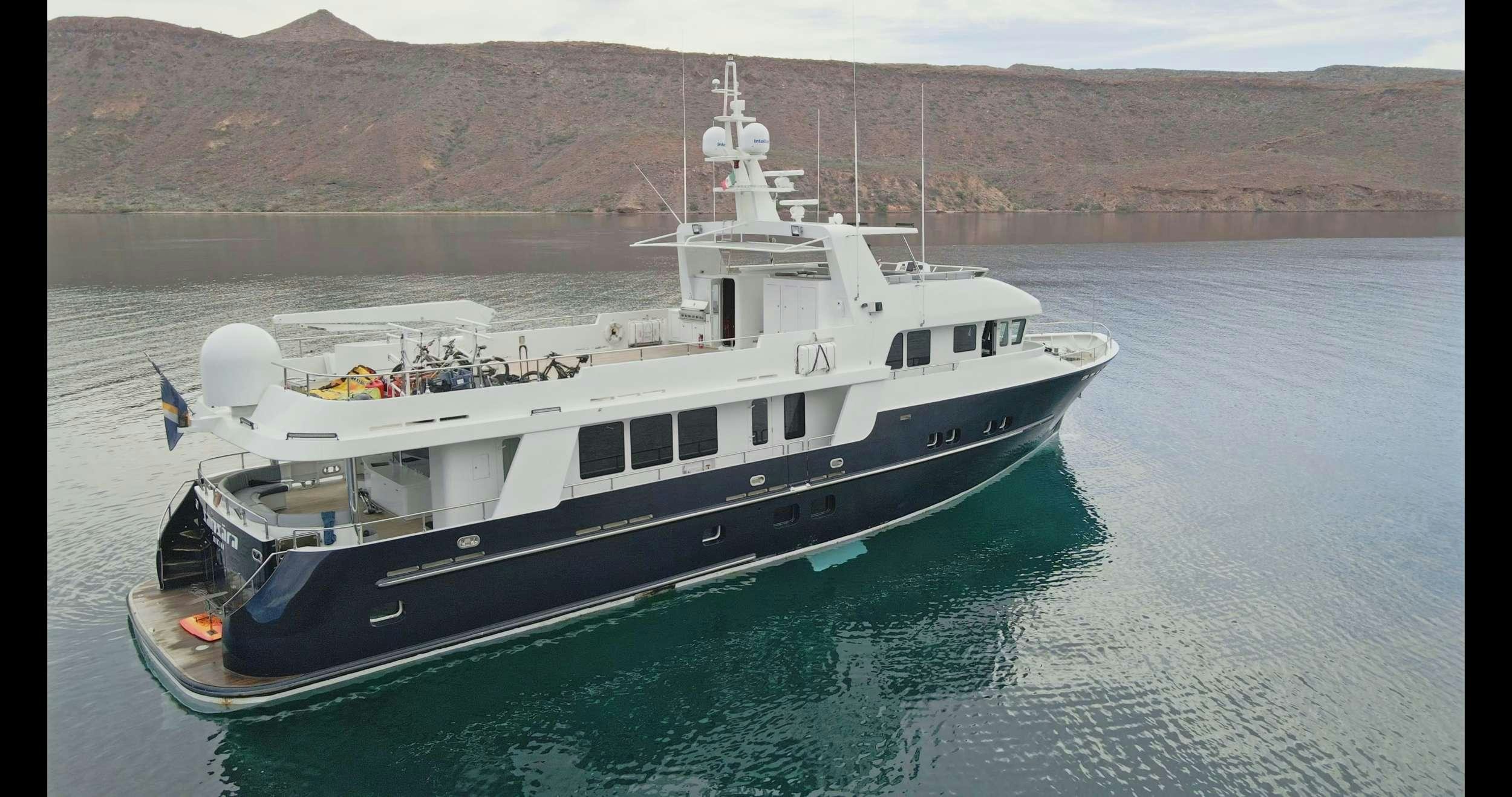 a large ship in the water aboard SAMSARA Yacht for Charter