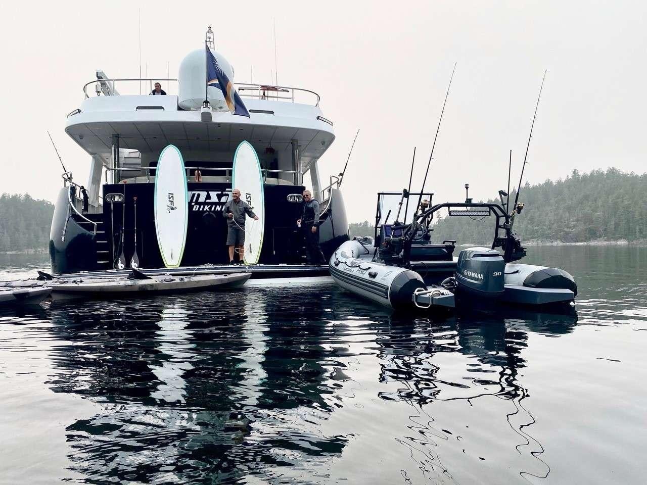 a boat with a person standing on the front aboard SAMSARA Yacht for Charter