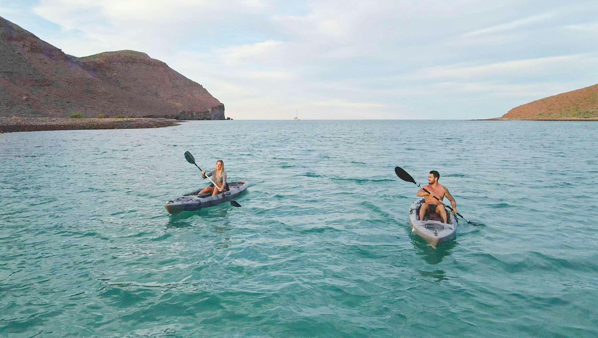 a couple of people in a boat aboard SAMSARA Yacht for Charter