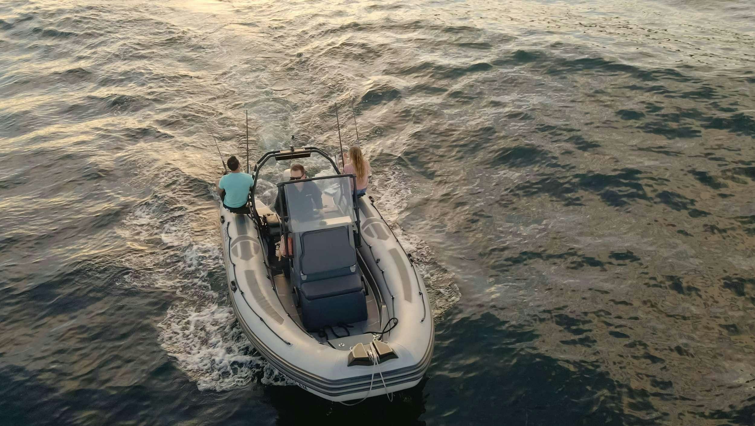 a person driving a boat on the water aboard SAMSARA Yacht for Charter