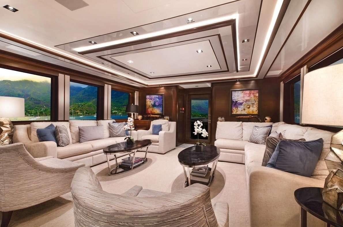 a living room with a large window aboard VIVIERAE II Yacht for Charter