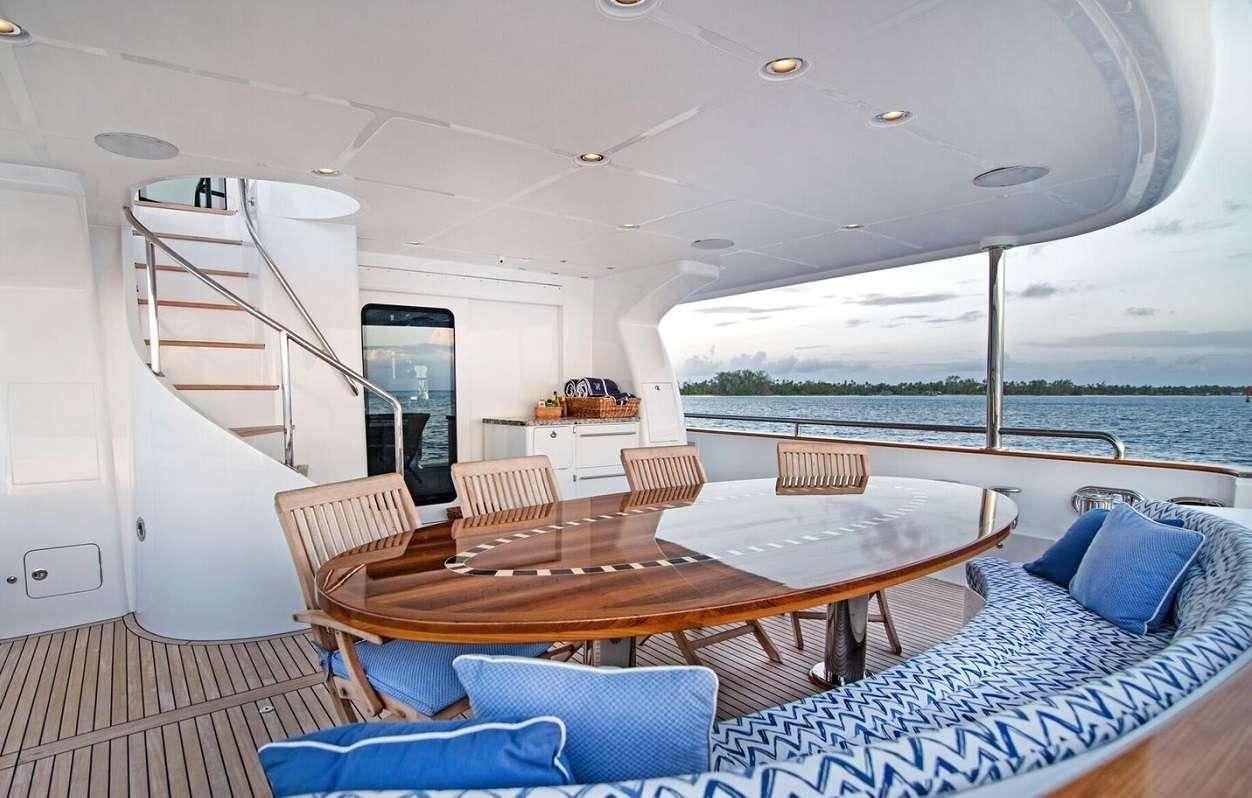 a table and chairs on a boat aboard VIVIERAE II Yacht for Charter