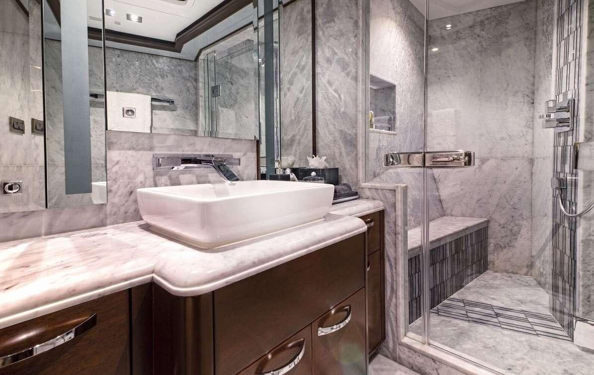 a bathroom with a sink and a mirror aboard VIVIERAE II Yacht for Charter