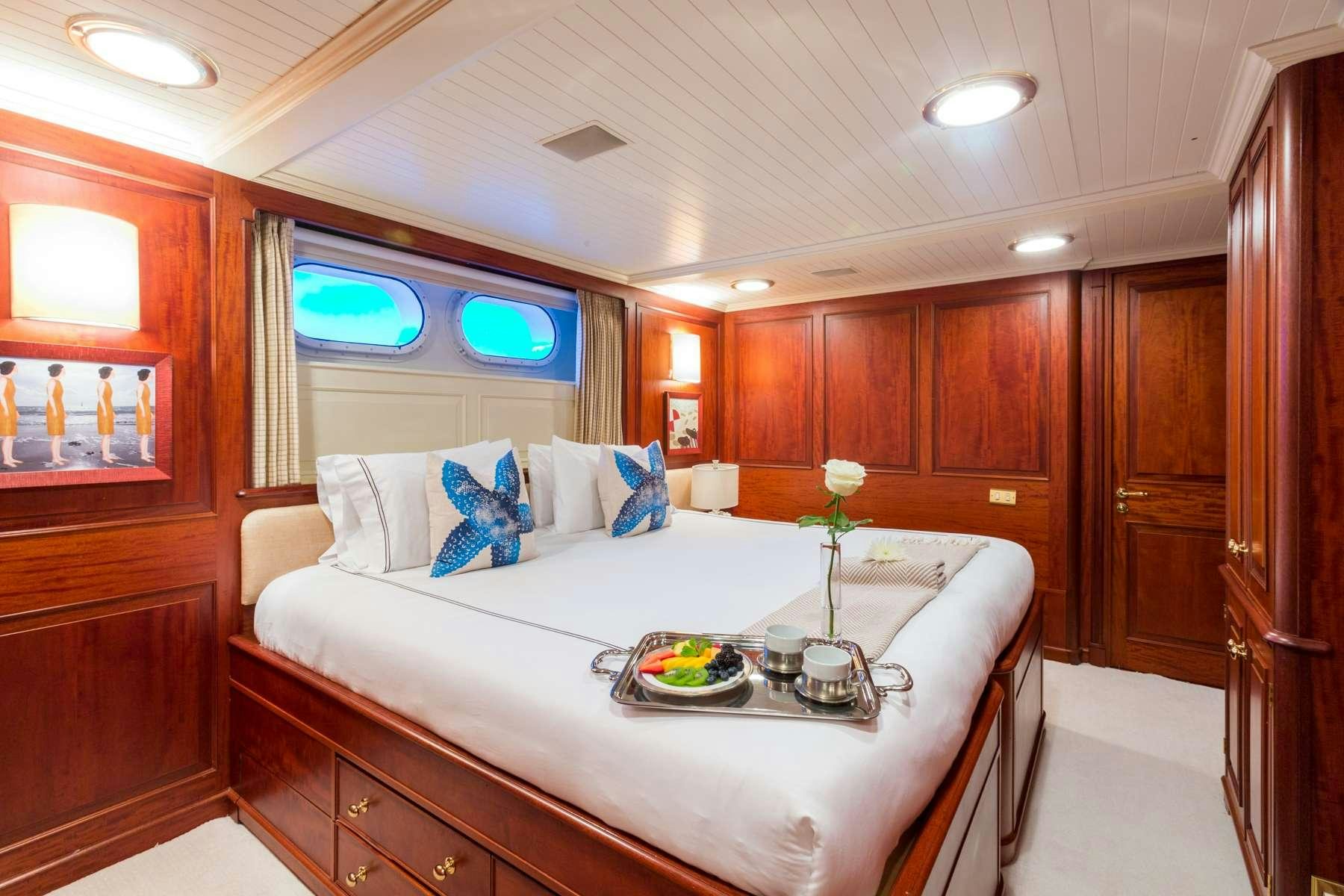 a bed in a room aboard LADY J Yacht for Charter