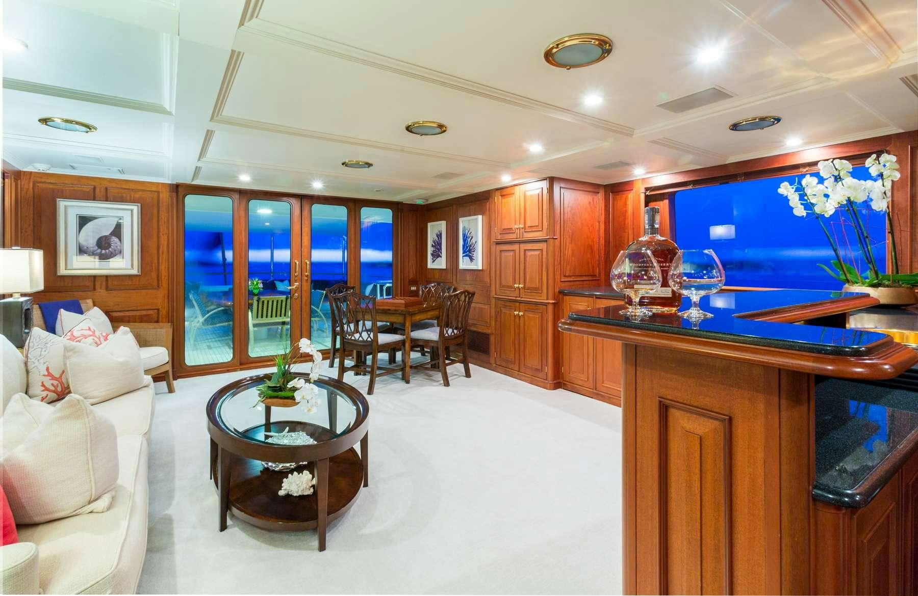 a living room with a large television aboard LADY J Yacht for Charter
