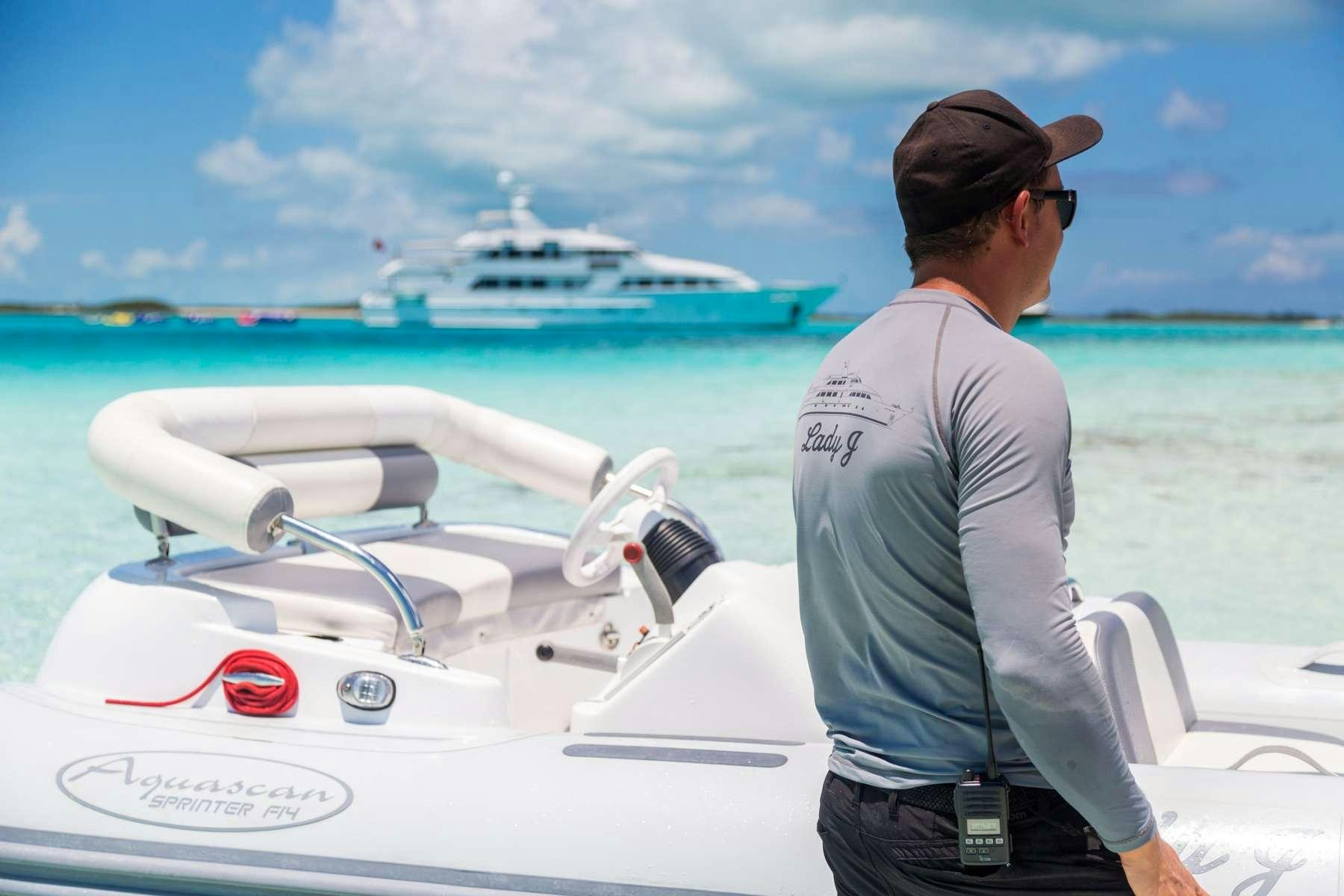 a person standing on a boat aboard LADY J Yacht for Charter