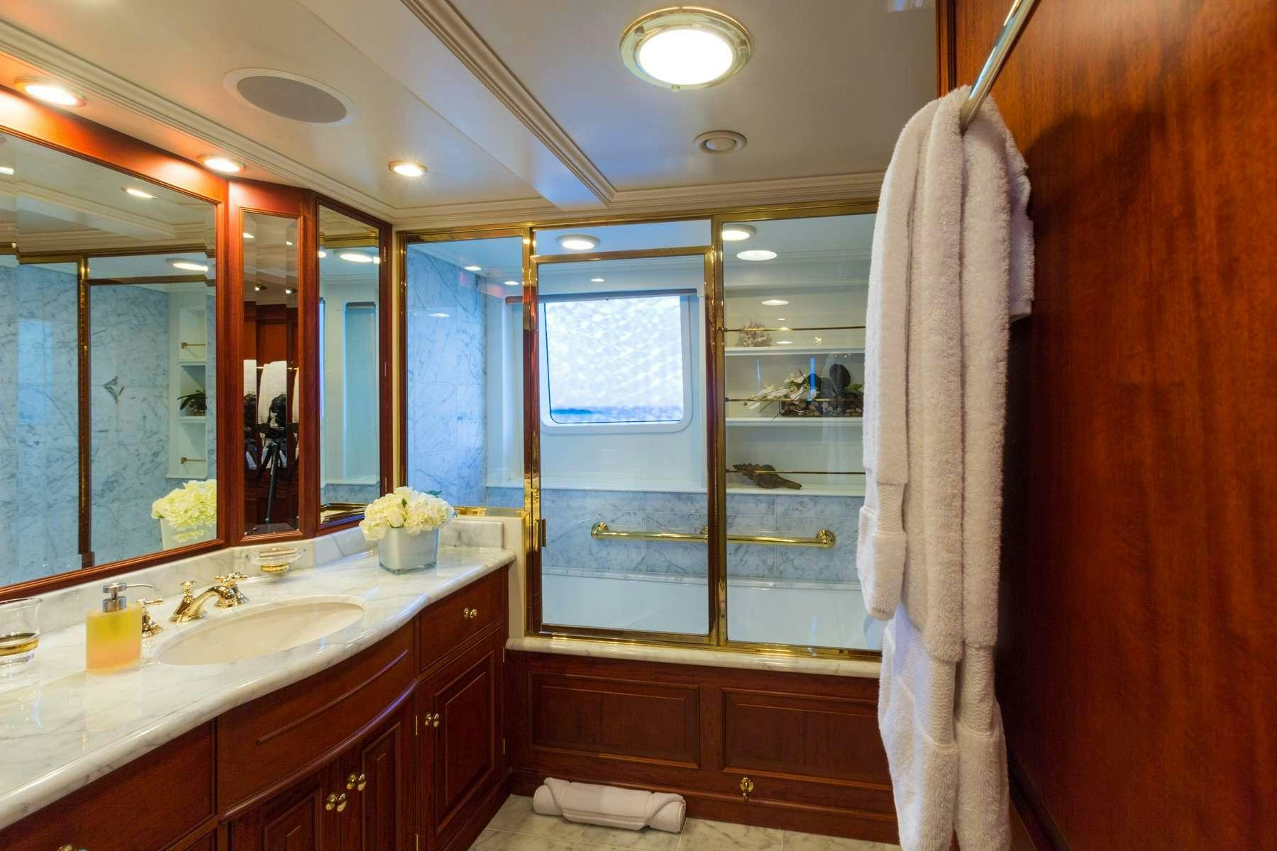 a bathroom with a large mirror aboard LADY J Yacht for Charter
