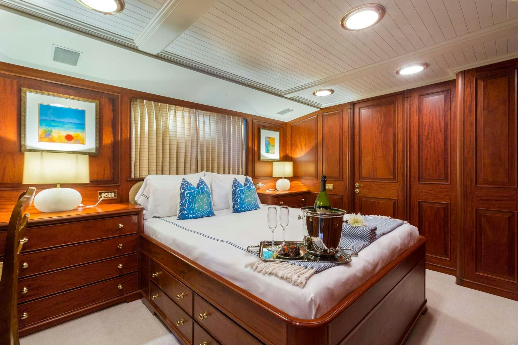 a large bedroom with a large bed aboard LADY J Yacht for Charter