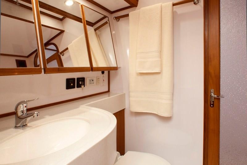 a bathroom with a sink and toilet aboard ARCHANGEL Yacht for Charter