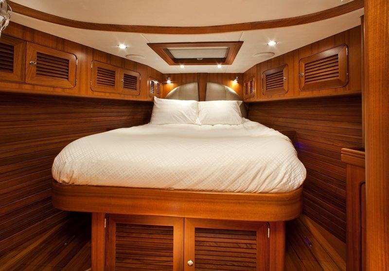 a bed with white sheets aboard ARCHANGEL Yacht for Charter