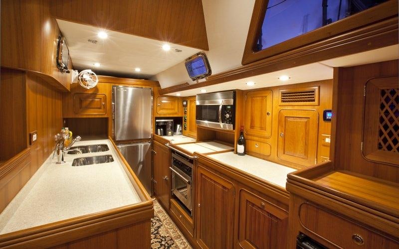 a kitchen with a large island aboard ARCHANGEL Yacht for Charter