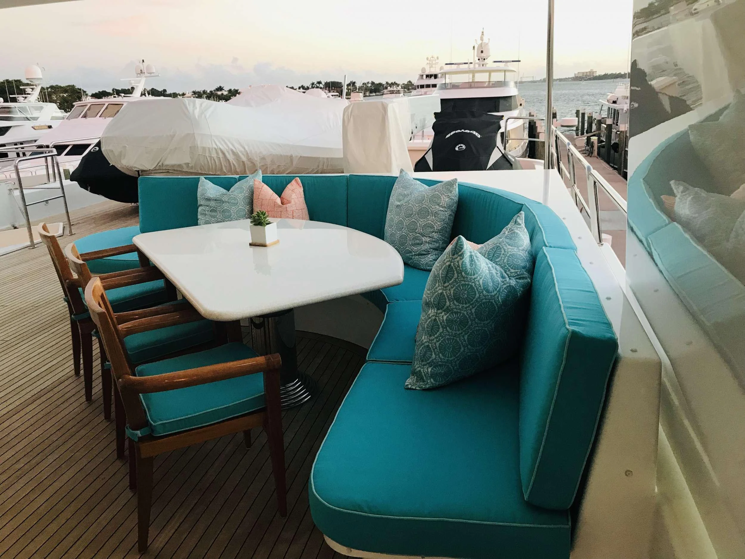 a table and chairs on a balcony aboard RELENTLESS Yacht for Charter