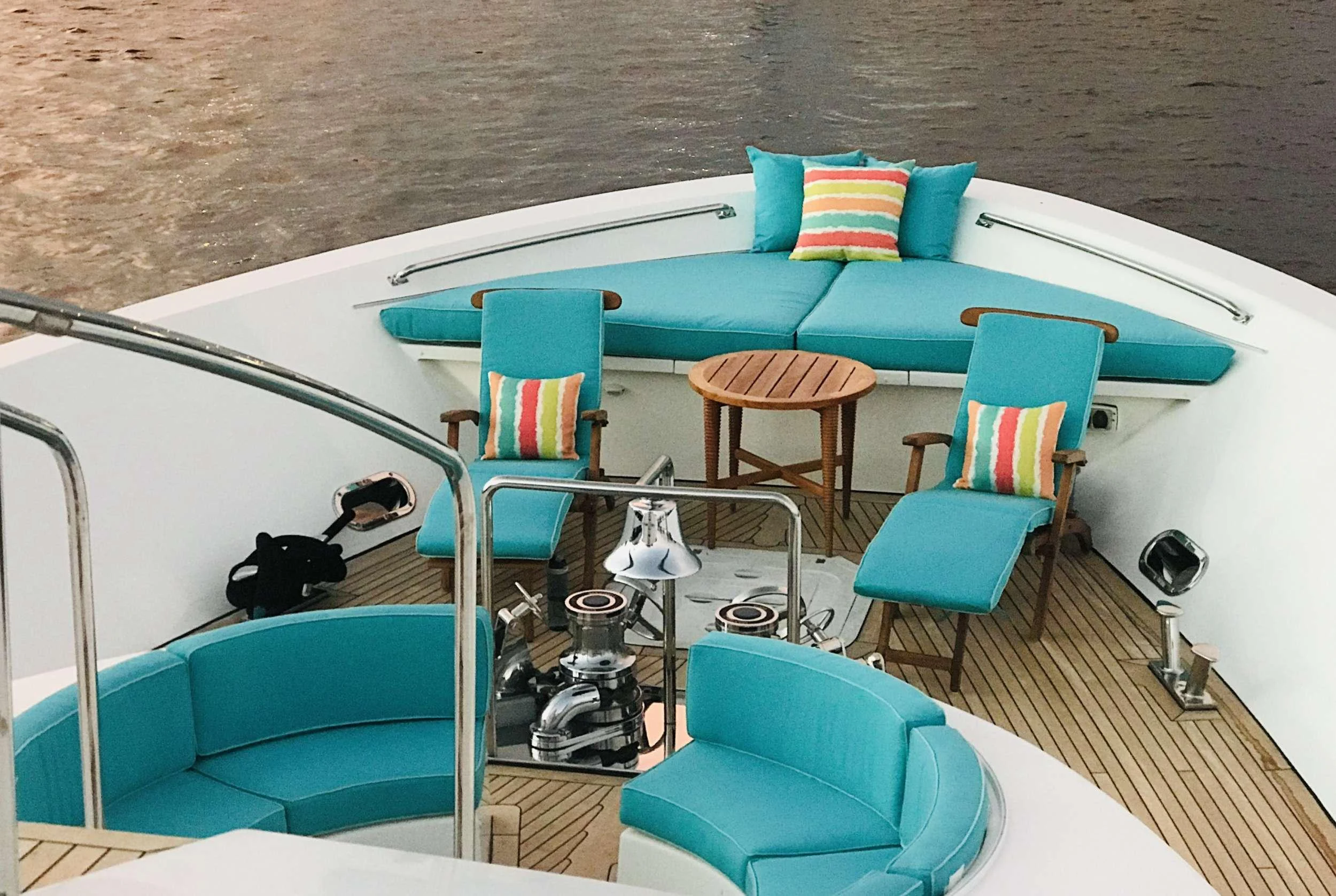 a boat with a table and chairs aboard RELENTLESS Yacht for Charter