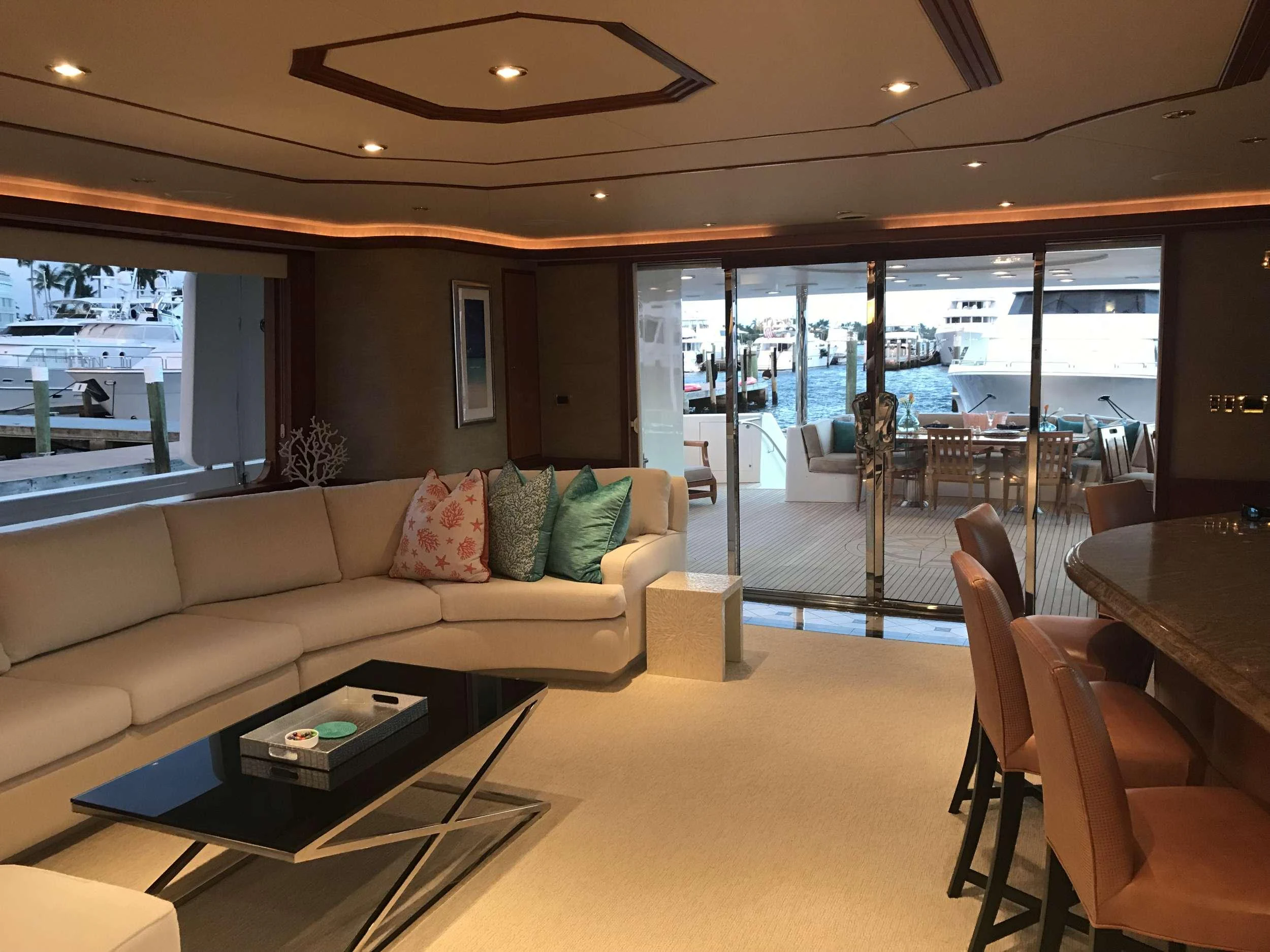 a living room with a glass door aboard RELENTLESS Yacht for Charter