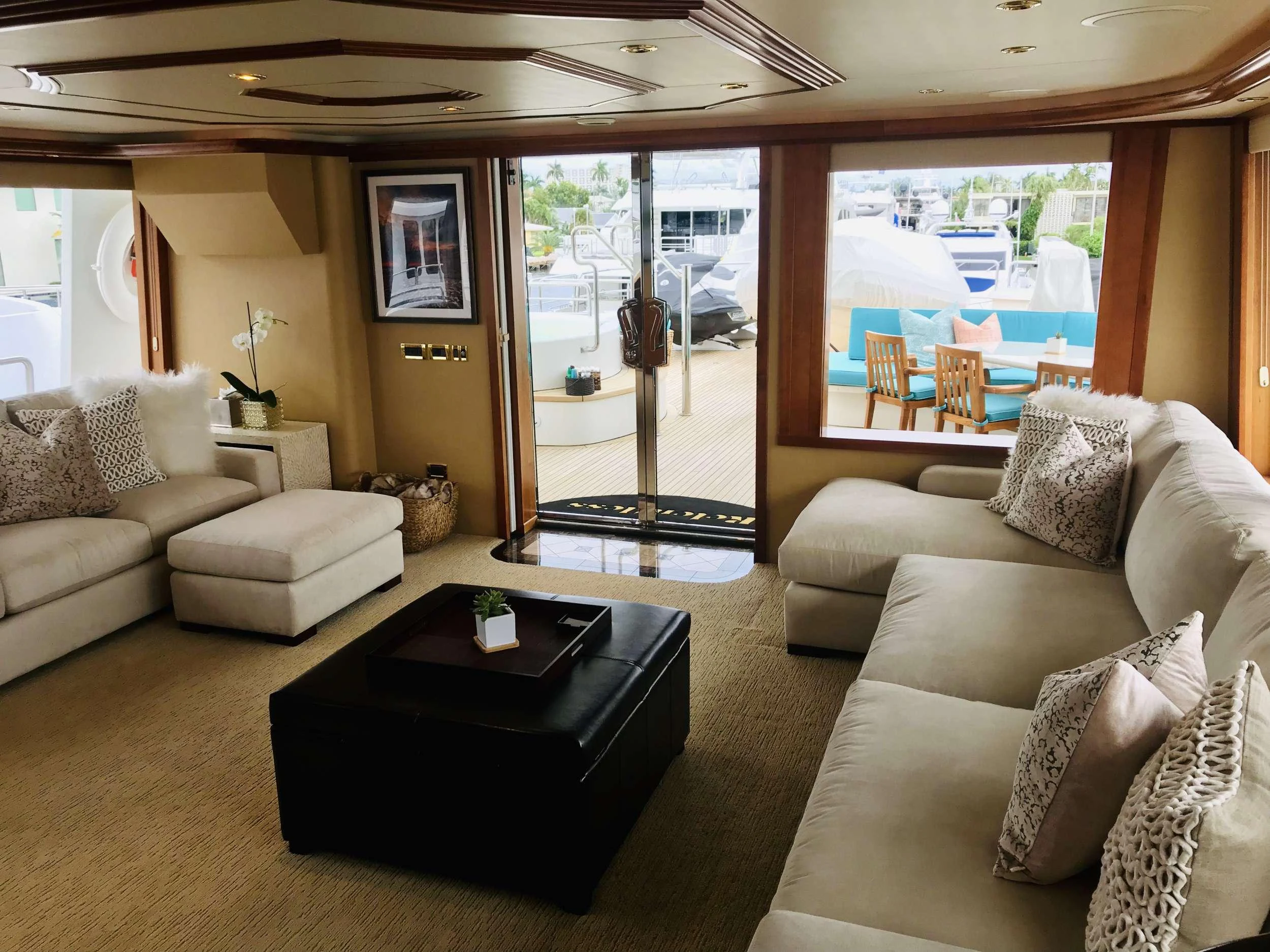 a living room with a large window aboard RELENTLESS Yacht for Charter
