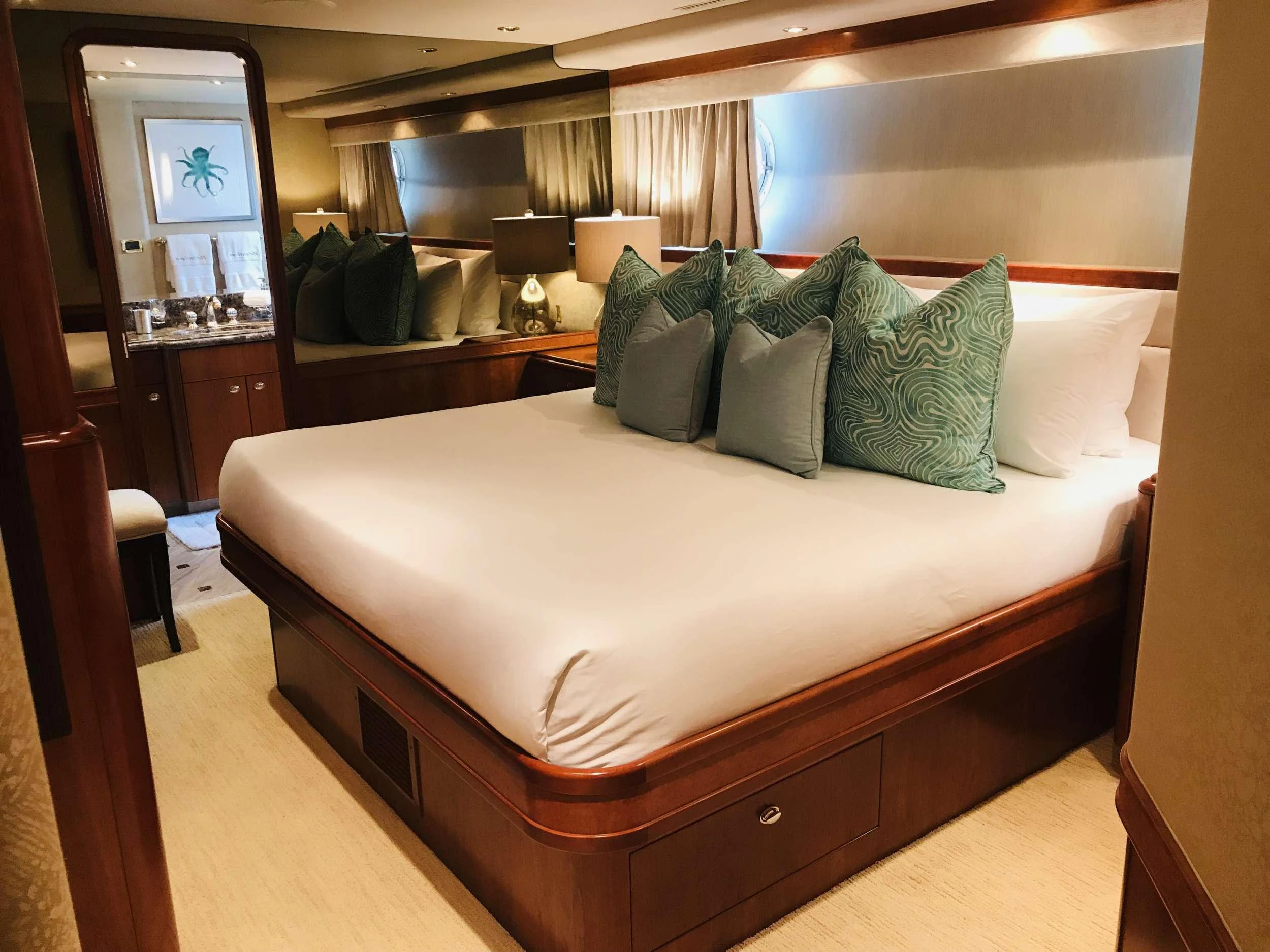 a bed with pillows aboard RELENTLESS Yacht for Charter