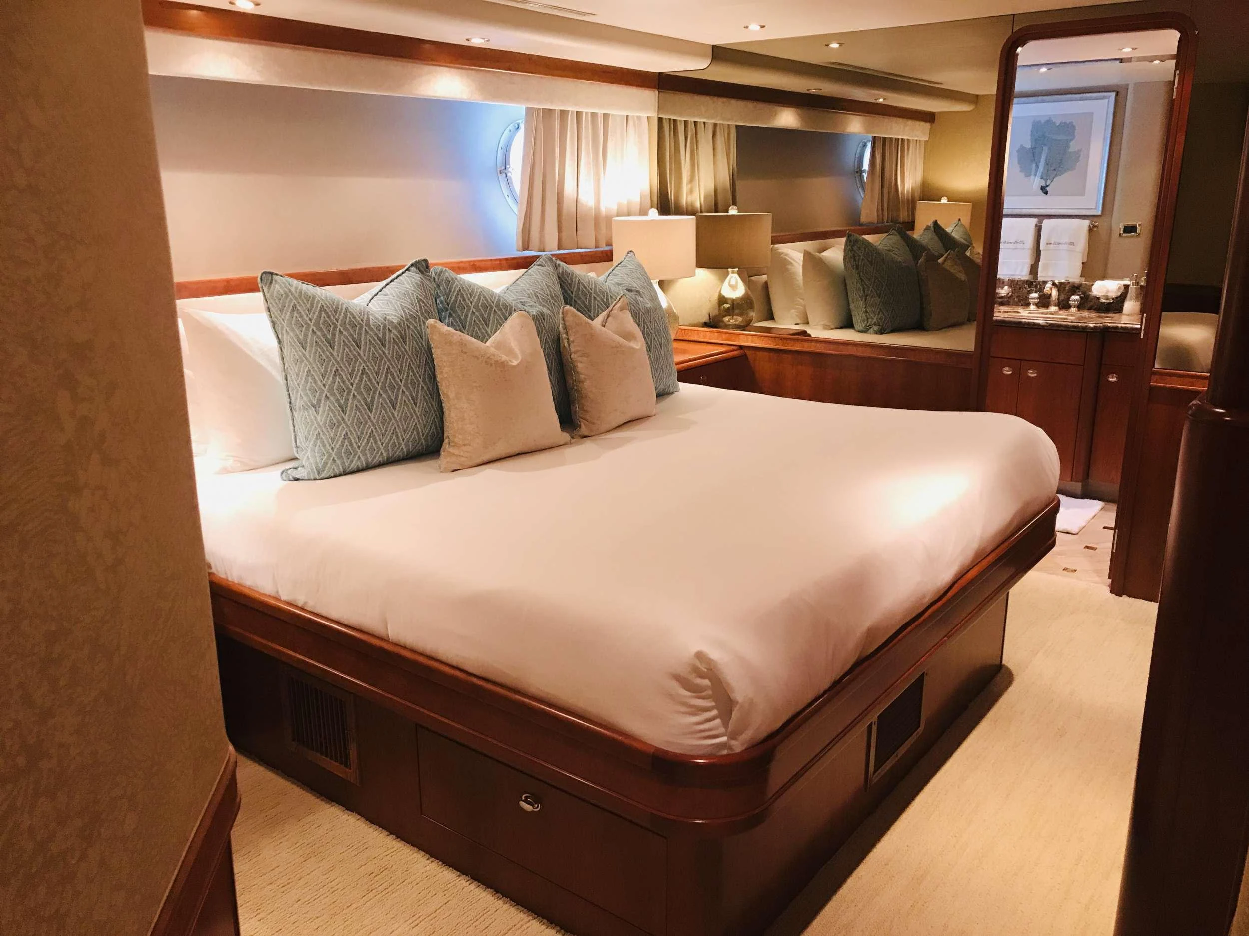 a bed with pillows aboard RELENTLESS Yacht for Charter