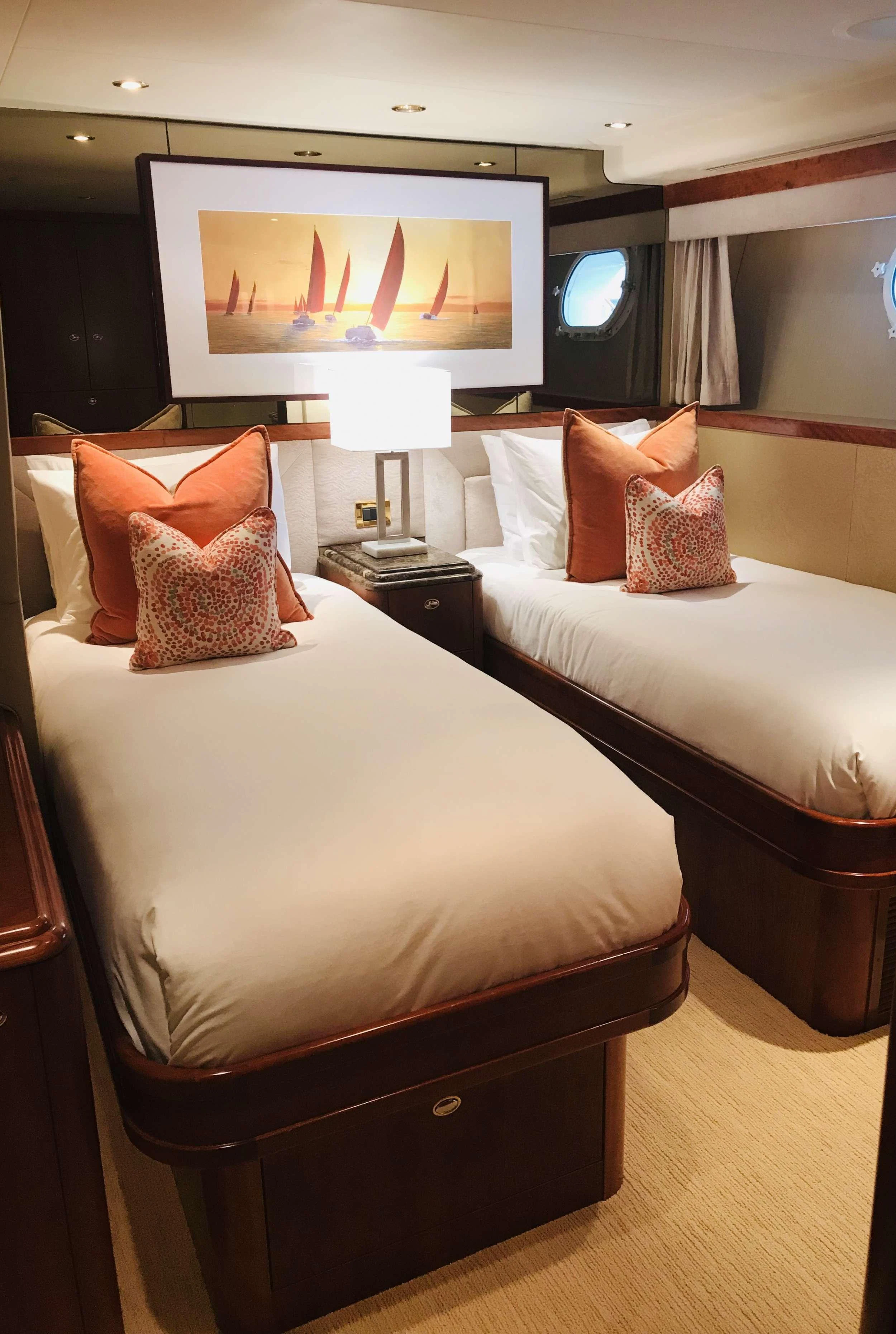 a room with two beds aboard RELENTLESS Yacht for Charter