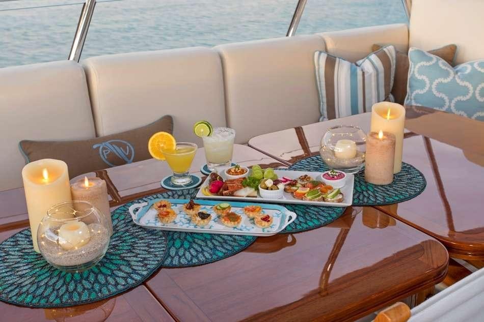 a table with food on it aboard PURA VIDA Yacht for Charter