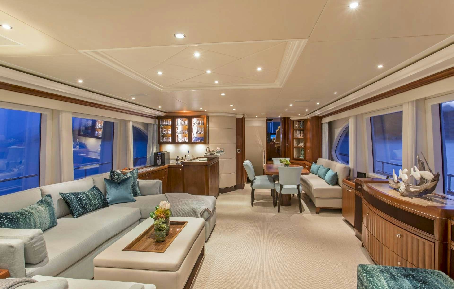 a living room with a couch and a coffee table aboard PURA VIDA Yacht for Charter