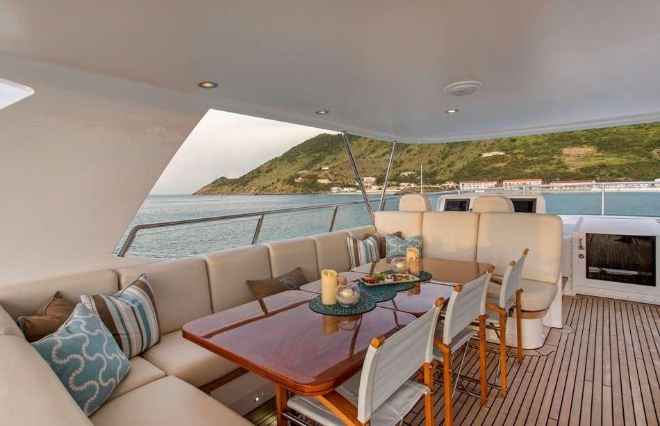 a living room with a large patio aboard PURA VIDA Yacht for Charter