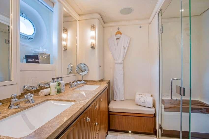 a bathroom with a sink and a mirror aboard PURA VIDA Yacht for Charter