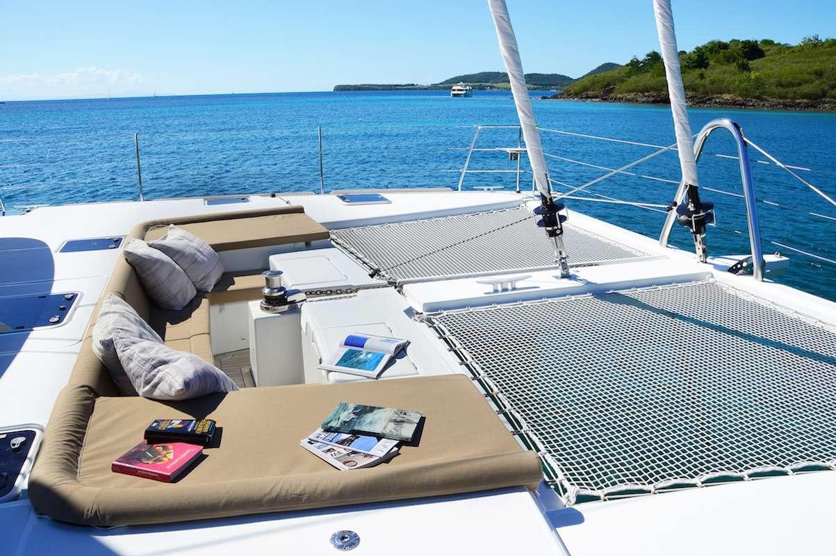 a person lying on a boat aboard BACCHUS Yacht for Charter