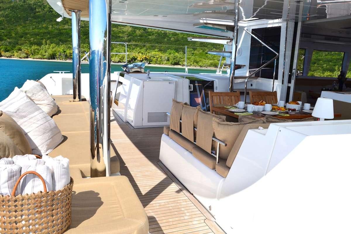 a deck with a pool and a deck aboard BACCHUS Yacht for Charter