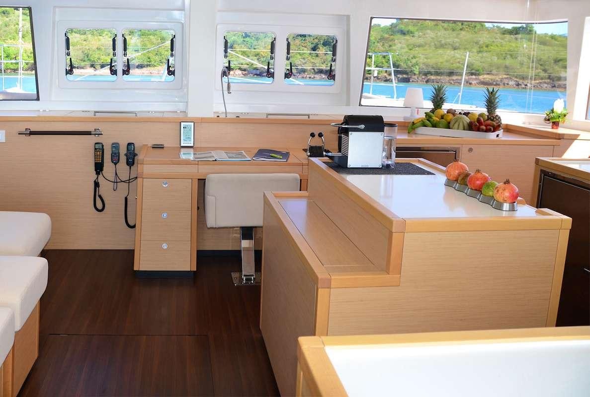 a kitchen with a counter and a sink aboard BACCHUS Yacht for Charter