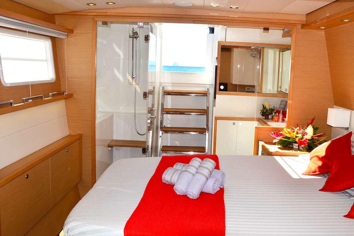a room with a bed and a ladder aboard BACCHUS Yacht for Charter