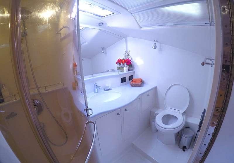 a bathroom with a toilet sink and a shower aboard KELEA Yacht for Charter