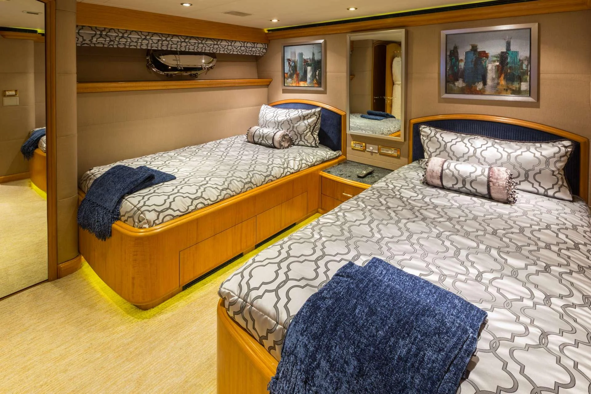 The guest stateroom features twin beds with elegant bedding and tasteful decor. aboard CHARLOTTE ANN Yacht for Charter
