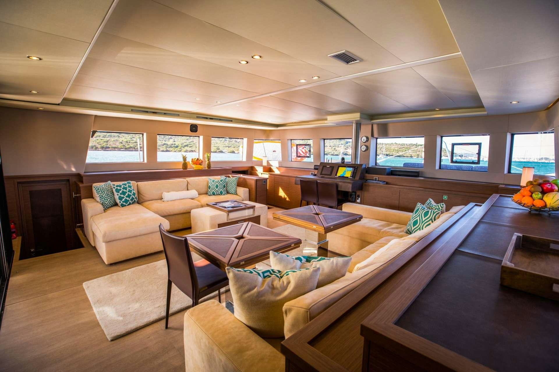 a living room with a couch and a fireplace aboard LADY FIONA Yacht for Charter