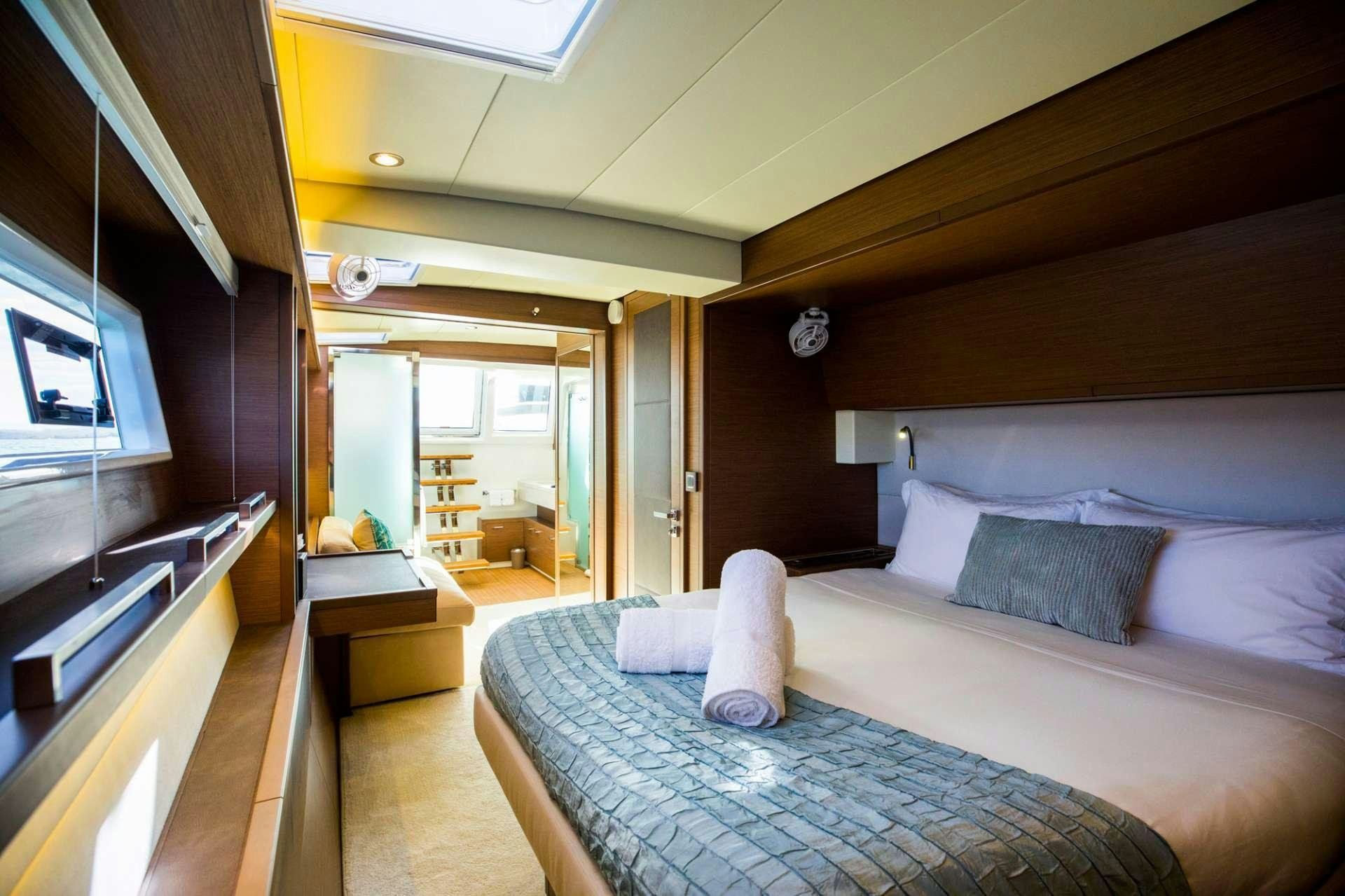 a room with a bed and a window aboard LADY FIONA Yacht for Charter