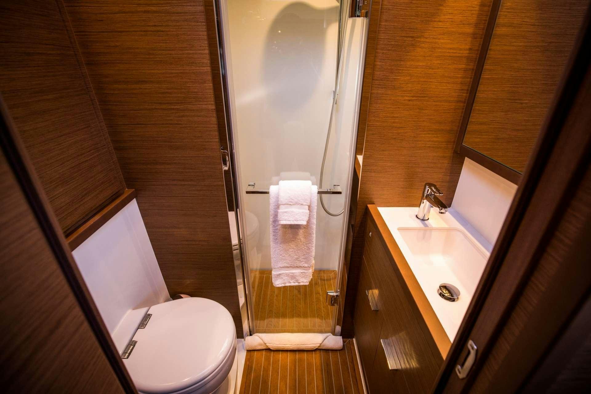 a bathroom with a glass shower door aboard LADY FIONA Yacht for Charter