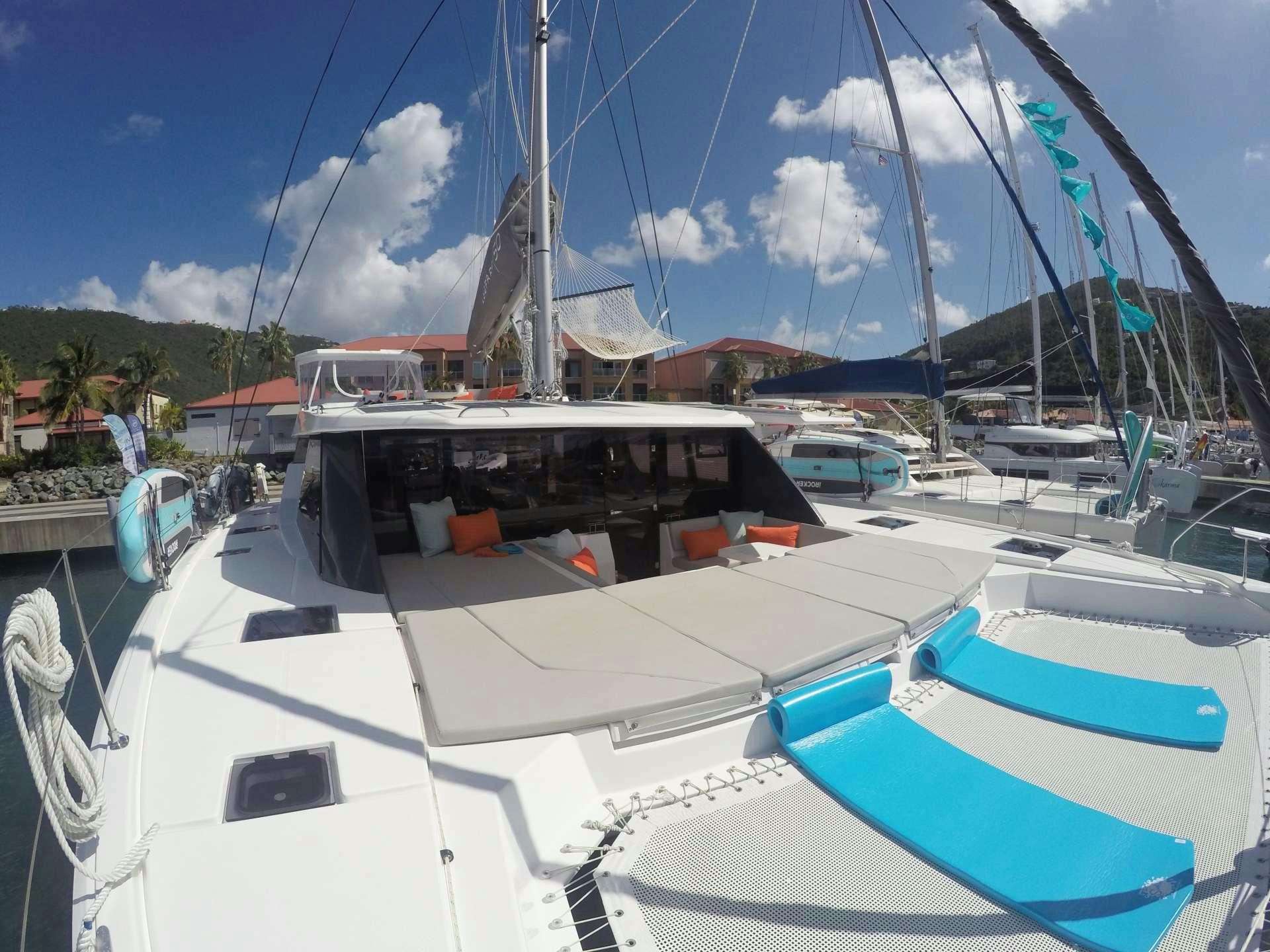 a group of boats are parked in a harbor aboard MOON BLOSSOM Yacht for Charter