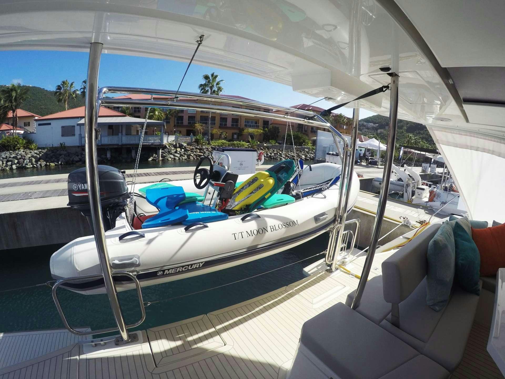 a boat parked on a deck aboard MOON BLOSSOM Yacht for Charter