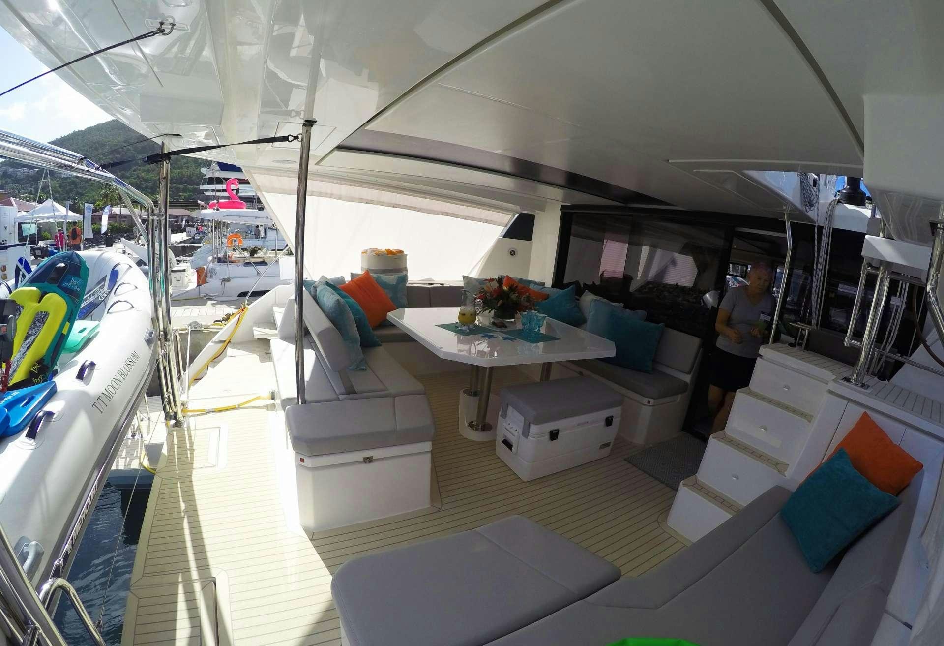 a room with a table and chairs aboard MOON BLOSSOM Yacht for Charter