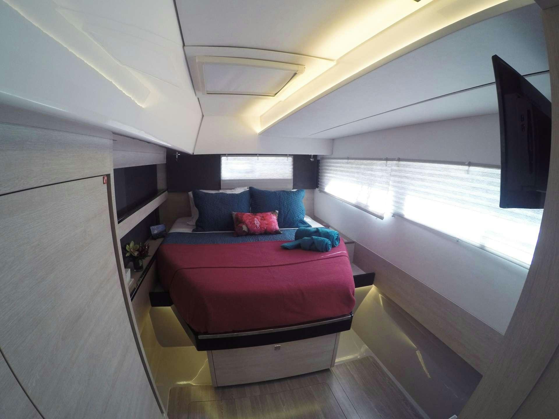 a bed in a room aboard MOON BLOSSOM Yacht for Charter