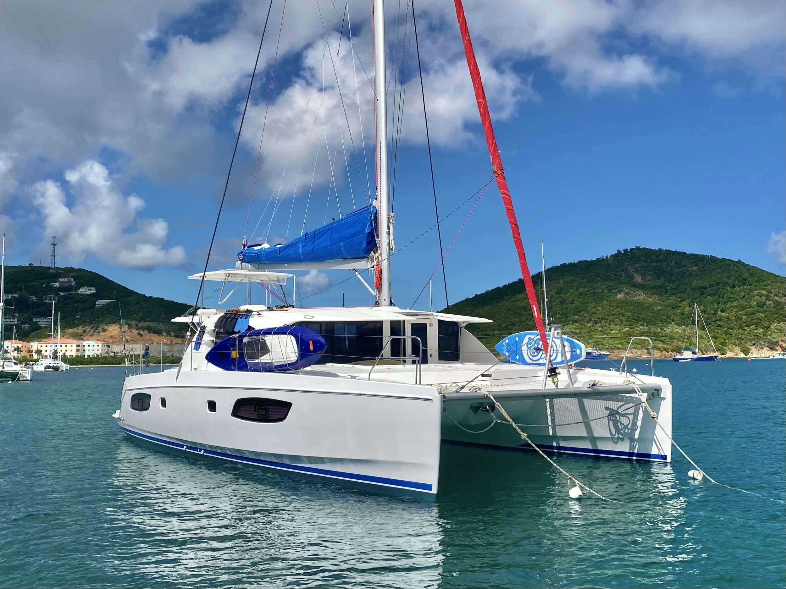 a boat with a red crane on it aboard LET'S PLAY TWO Yacht for Charter