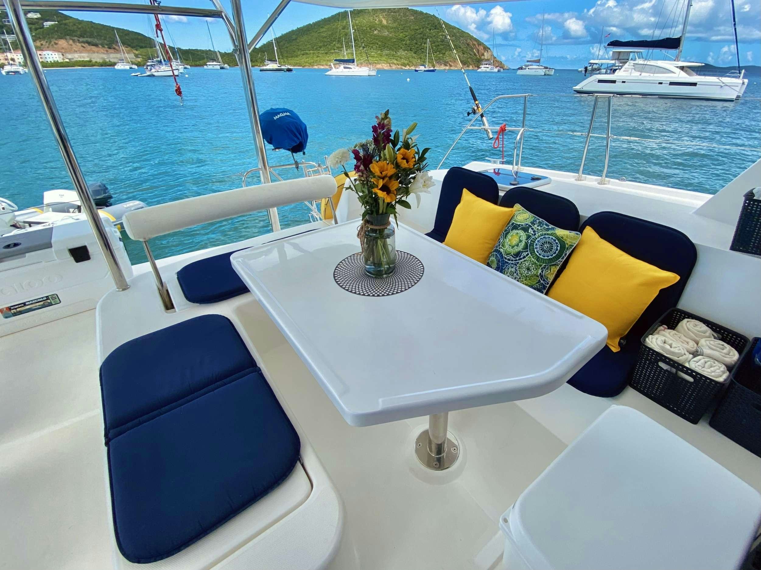 a boat with a vase of flowers on it aboard LET'S PLAY TWO Yacht for Charter