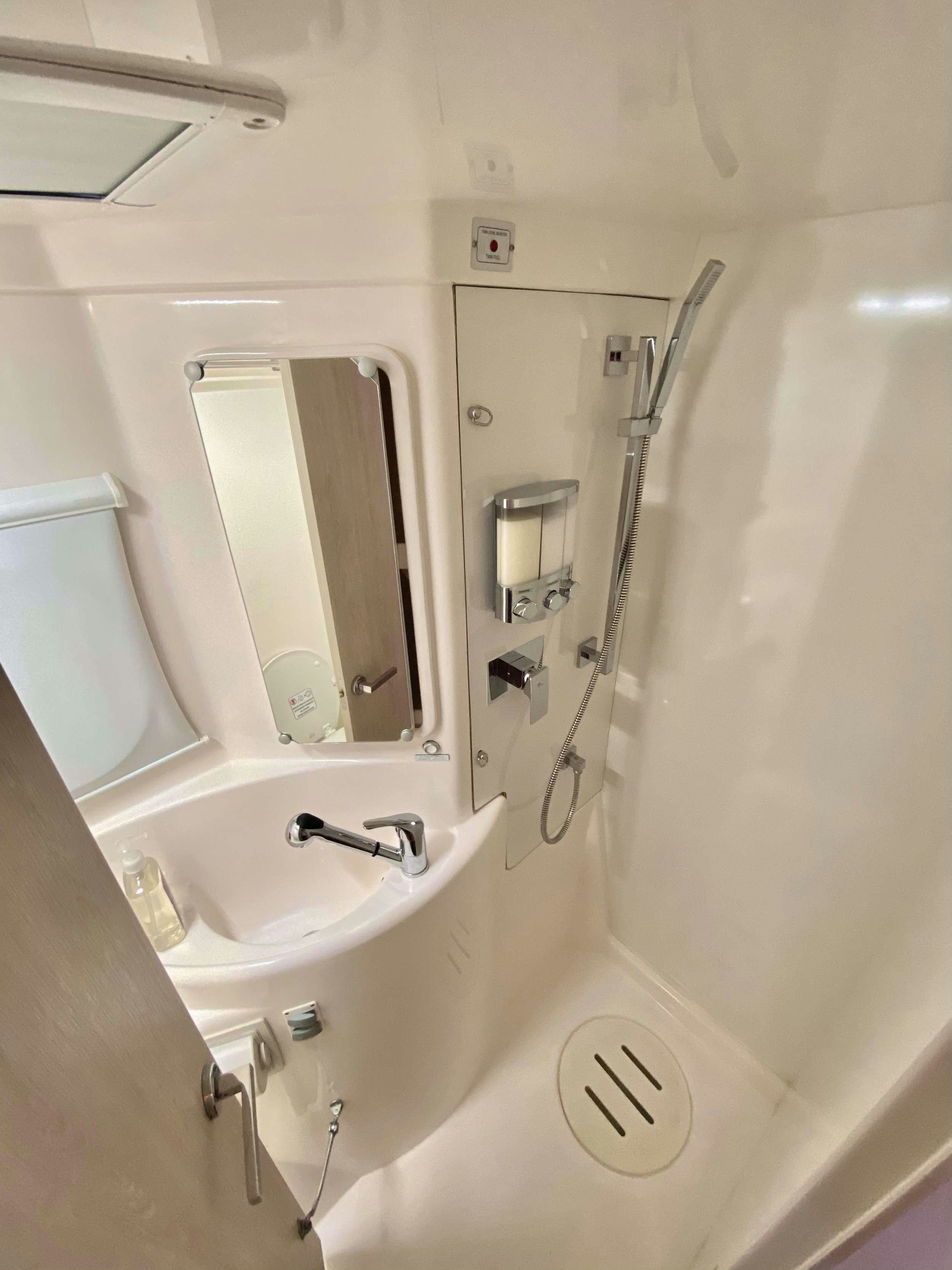 a bathroom with a mirror aboard LET'S PLAY TWO Yacht for Charter