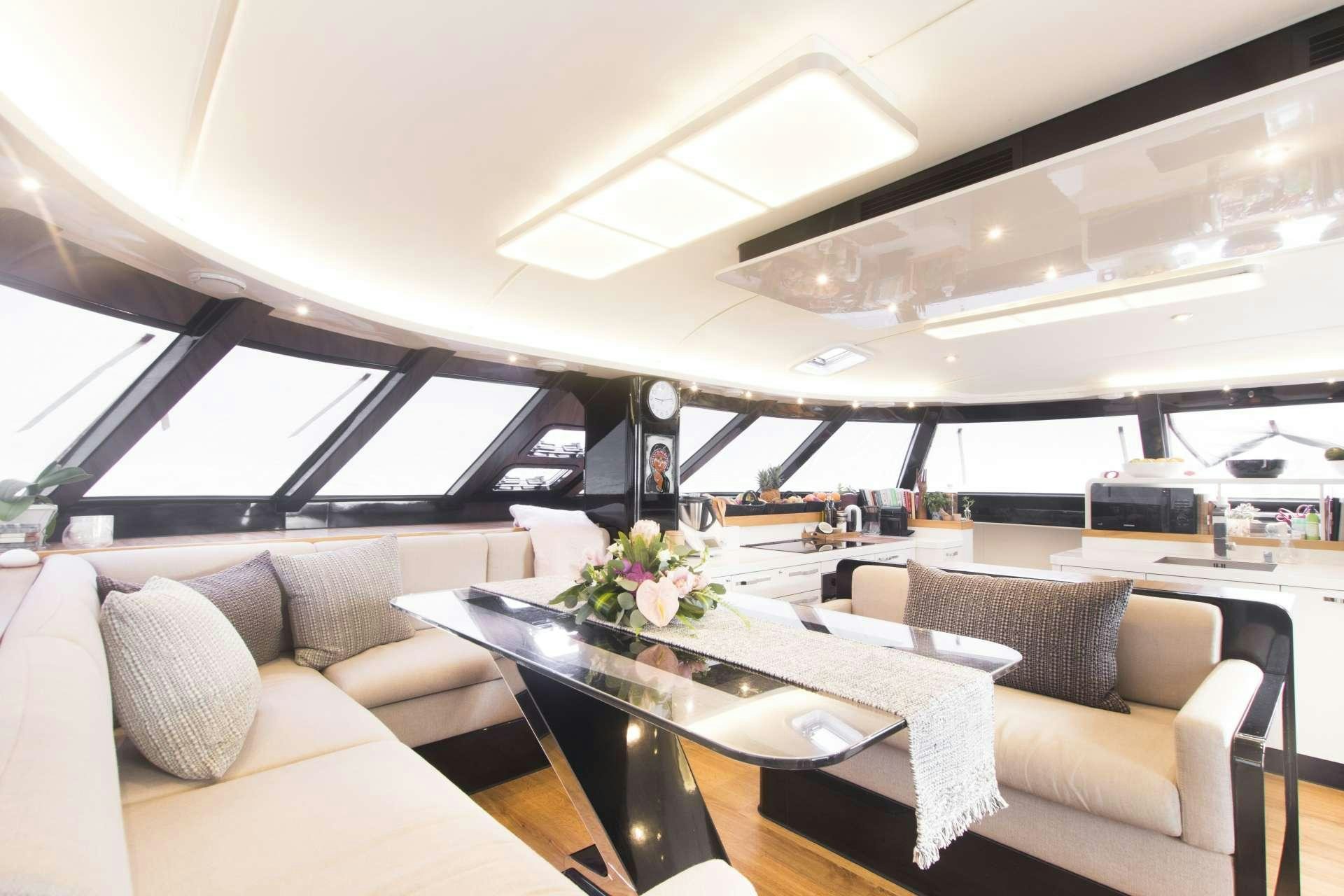 a room with couches and a table aboard SANTA ANA Yacht for Charter
