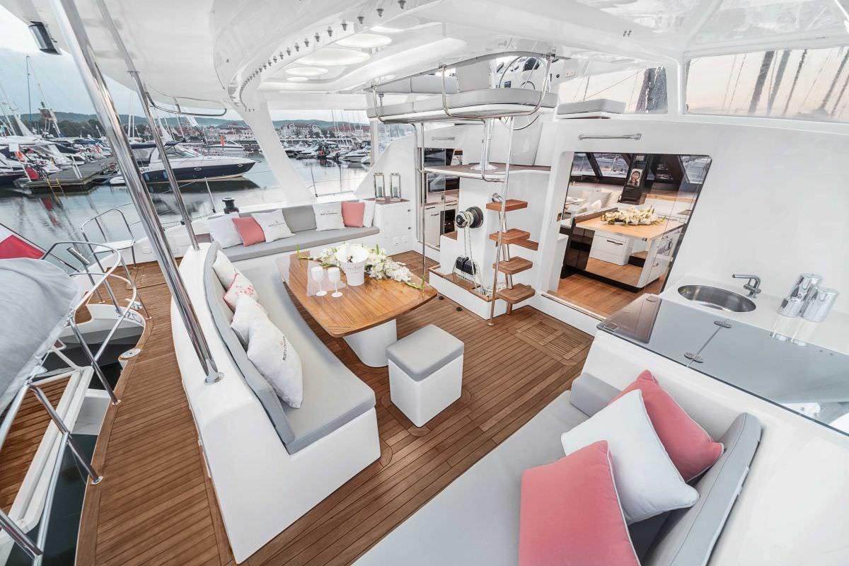 a room with a table and chairs aboard SANTA ANA Yacht for Charter