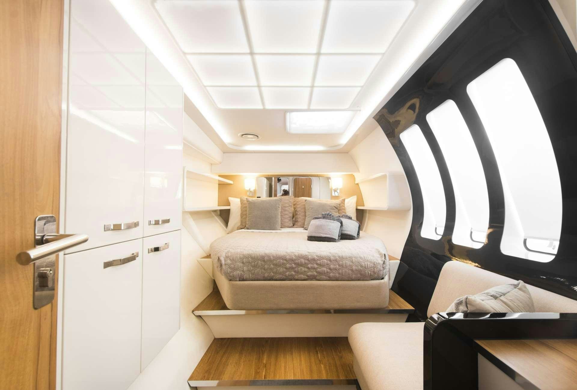 a room with a bed and a couch aboard SANTA ANA Yacht for Charter