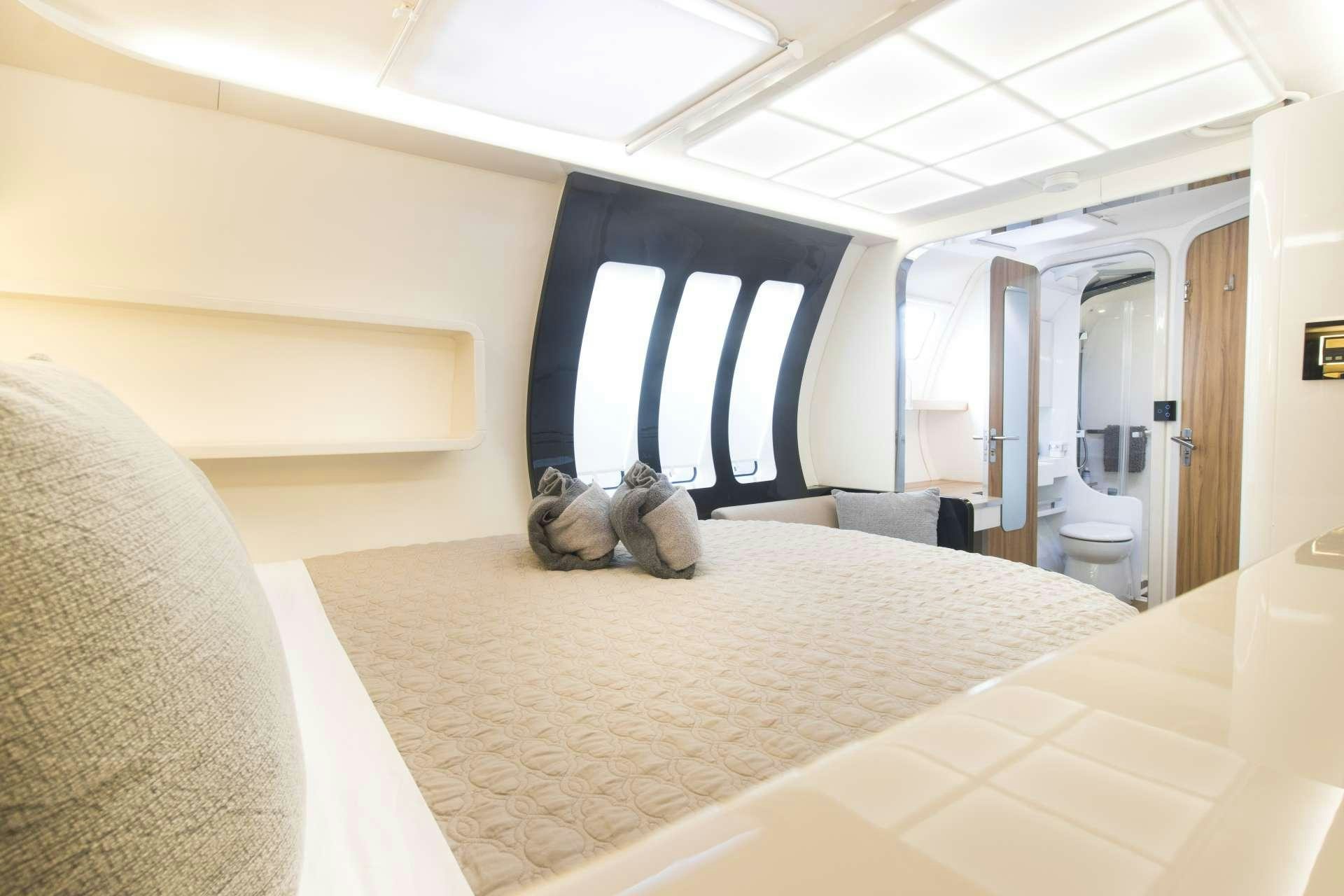 a large room with a large bed aboard SANTA ANA Yacht for Charter