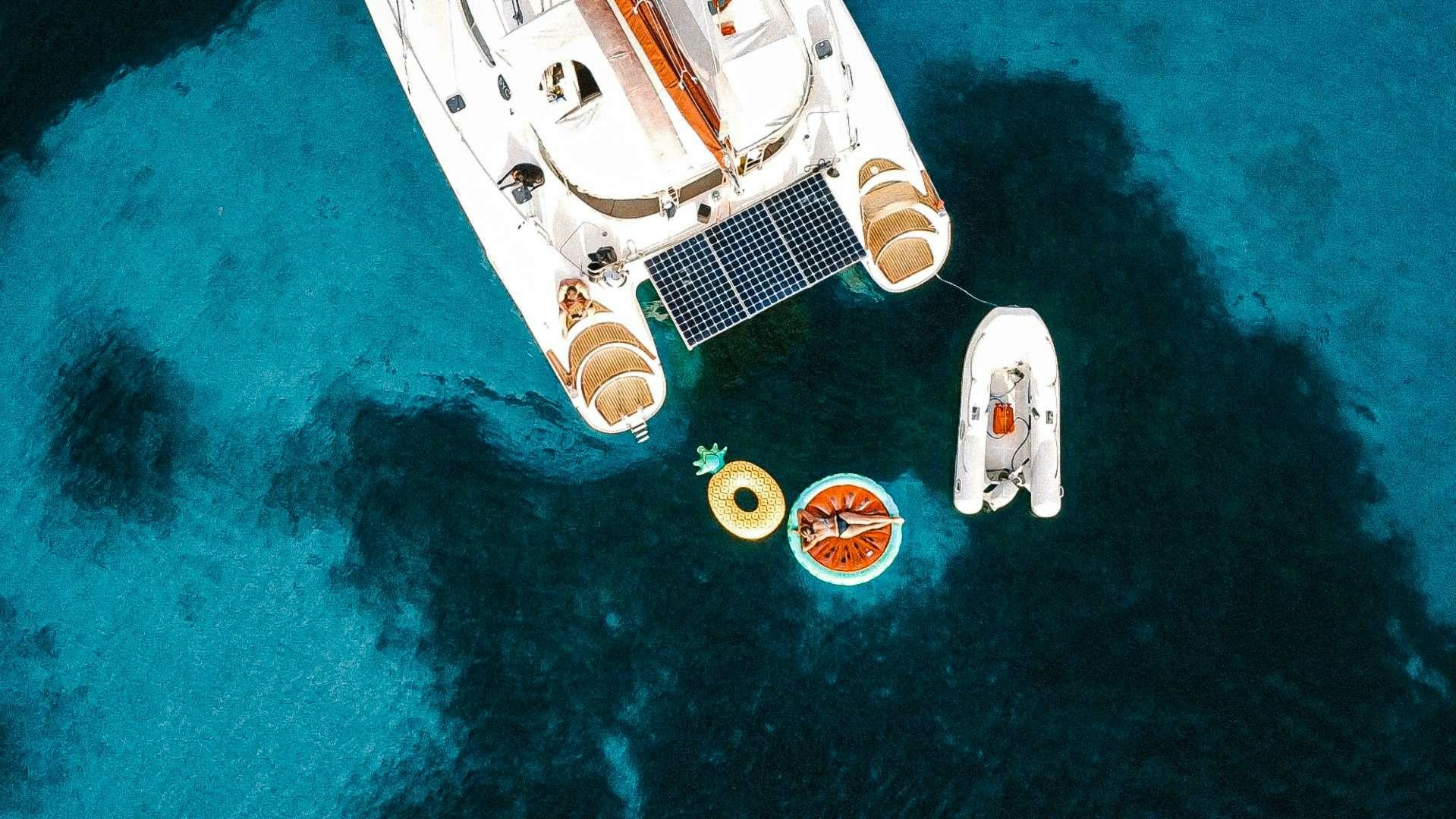 a satellite above a planet aboard Cataja Yacht for Charter